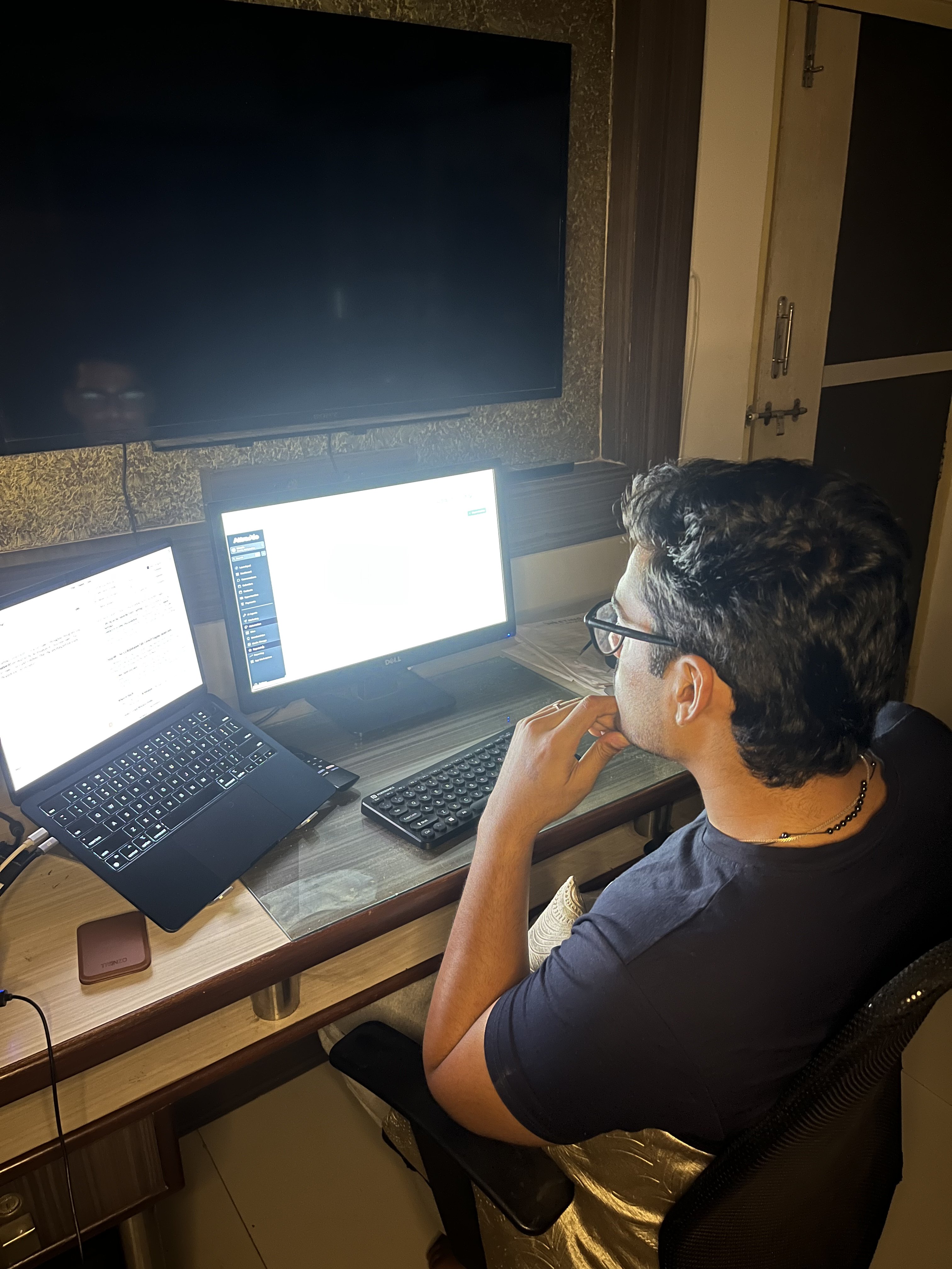 Alen Baby working on the Attractio growth system on dual monitors